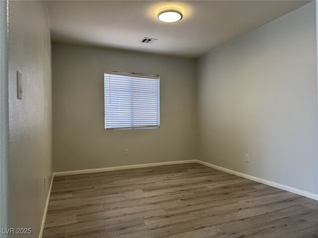 11029 Meadow Leaf Ave, Las Vegas, NV 89144 - empty room featuring wood finished floors and baseboards