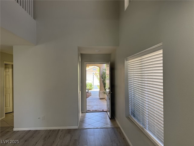 11029 Meadow Leaf Ave, Las Vegas, NV 89144 - entrance foyer with a towering ceiling, light wood-style flooring, and baseboards