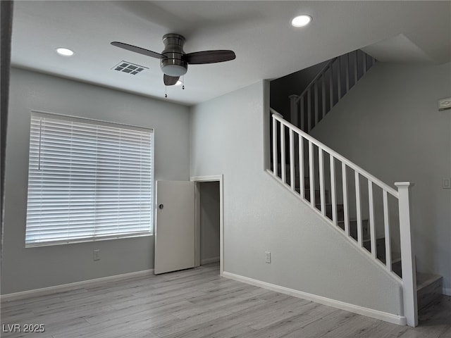 11029 Meadow Leaf Ave, Las Vegas, NV 89144 - unfurnished living room with a ceiling fan, wood finished floors, stairs, baseboards, and recessed lighting