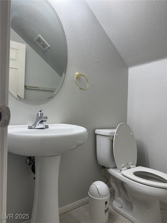 11029 Meadow Leaf Ave, Las Vegas, NV 89144 - bathroom featuring toilet, a sink, and baseboards
