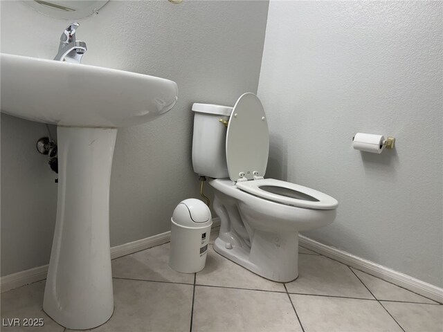 11029 Meadow Leaf Ave, Las Vegas, NV 89144 - half bathroom featuring toilet, tile patterned flooring, and baseboards