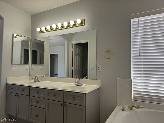 11029 Meadow Leaf Ave, Las Vegas, NV 89144 - full bathroom with double vanity and a garden tub