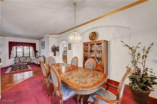 7461 Tahoe Basin Dr, Las Vegas, NV 89129 - dining room with a chandelier, wood finished floors, and crown molding