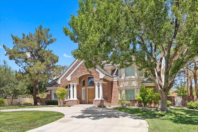 3102 La Mirada Ave, Las Vegas, NV 89120 - view of front of property featuring brick siding and curved driveway