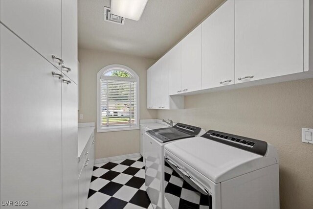 3102 La Mirada Ave, Las Vegas, NV 89120 - laundry room with cabinet space, tile patterned floors, and washing machine and dryer