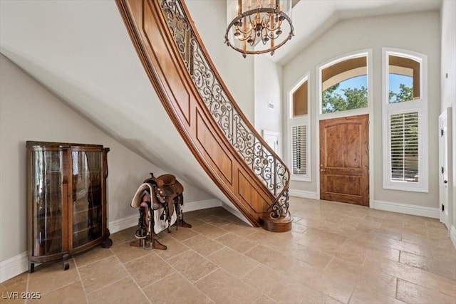3102 La Mirada Ave, Las Vegas, NV 89120 - foyer with stairway, a chandelier, stone tile flooring, and high vaulted ceiling