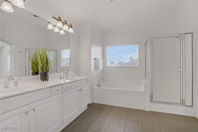 236 Dog Leg Dr, Las Vegas, NV 89148 - bathroom featuring a garden tub, double vanity, and an enclosed shower