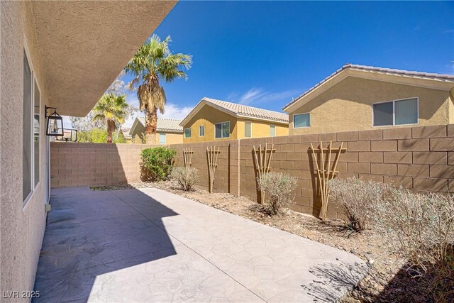 236 Dog Leg Dr, Las Vegas, NV 89148 - fenced backyard featuring a patio area