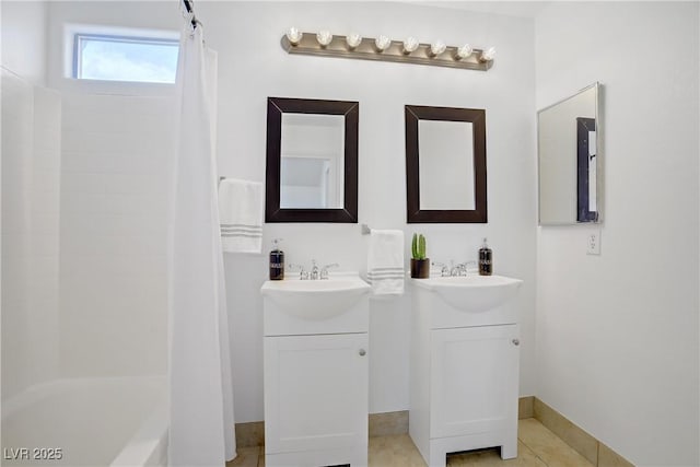 236 Dog Leg Dr, Las Vegas, NV 89148 - bathroom with two vanities, tile patterned flooring, and shower / bathtub combination with curtain