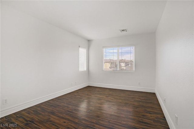 236 Dog Leg Dr, Las Vegas, NV 89148 - empty room with dark wood-style flooring and baseboards