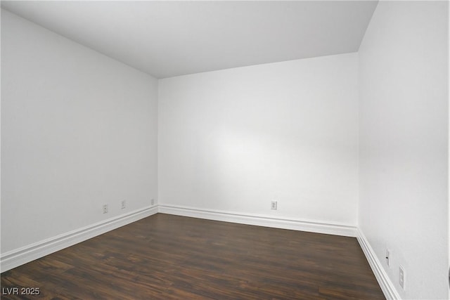 236 Dog Leg Dr, Las Vegas, NV 89148 - empty room with dark wood-style floors and baseboards
