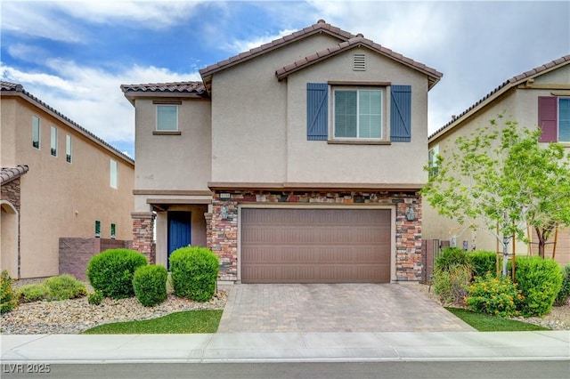 6334 Orions Belt Peak St, North Las Vegas, NV 89031 - view of front of home with stucco siding, stone siding, an attached garage, decorative driveway, and a tile roof