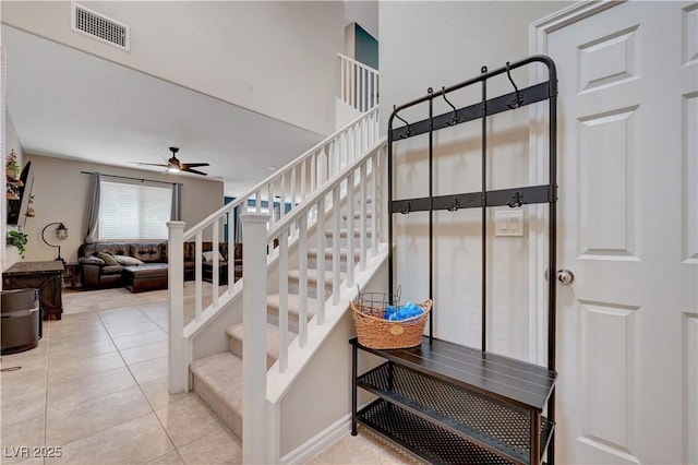 6334 Orions Belt Peak St, North Las Vegas, NV 89031 - stairway with ceiling fan and tile patterned flooring