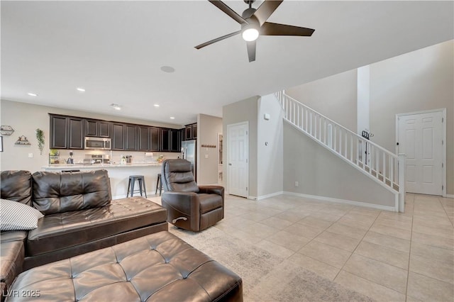 6334 Orions Belt Peak St, North Las Vegas, NV 89031 - living area featuring ceiling fan, stairs, light tile patterned flooring, recessed lighting, and baseboards