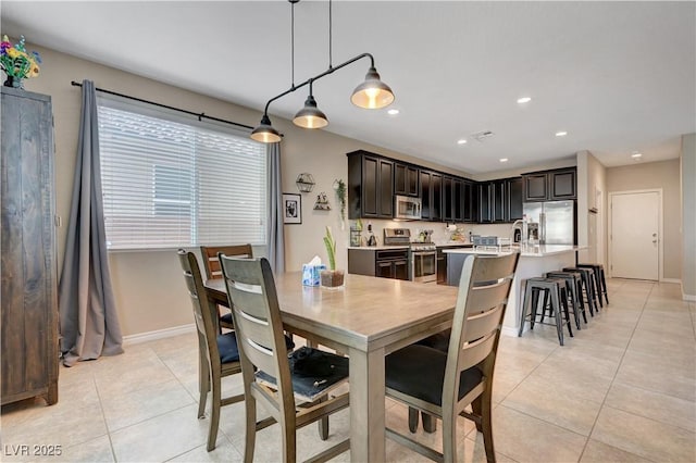 6334 Orions Belt Peak St, North Las Vegas, NV 89031 - dining area featuring light tile patterned flooring, baseboards, and recessed lighting