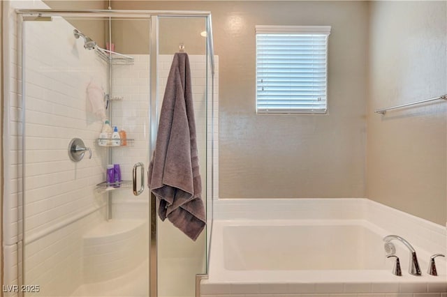 6334 Orions Belt Peak St, North Las Vegas, NV 89031 - full bathroom featuring a stall shower and a garden tub