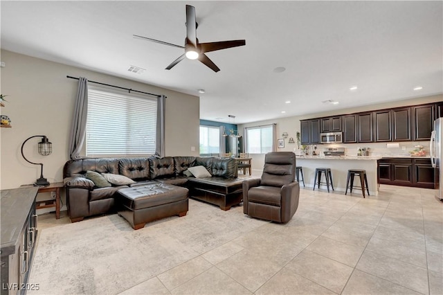 6334 Orions Belt Peak St, North Las Vegas, NV 89031 - living room with ceiling fan, light tile patterned floors, and recessed lighting