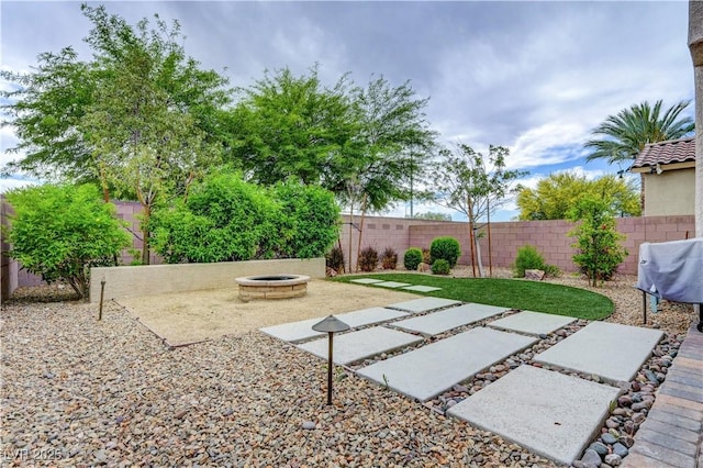 6334 Orions Belt Peak St, North Las Vegas, NV 89031 - fenced backyard featuring a fire pit and a patio