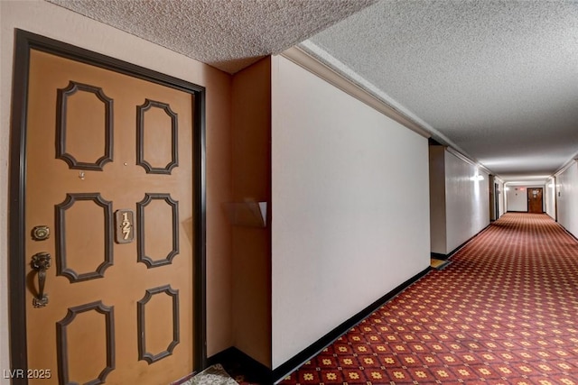 745 N Royal Crest Cir Unit 127, Las Vegas, NV 89169 - corridor featuring a textured ceiling, carpet flooring, and baseboards