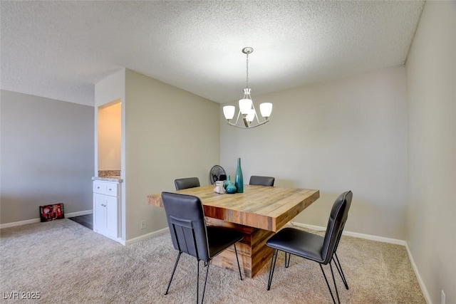 745 N Royal Crest Cir Unit 127, Las Vegas, NV 89169 - dining area featuring a chandelier, light carpet, a textured ceiling, and baseboards