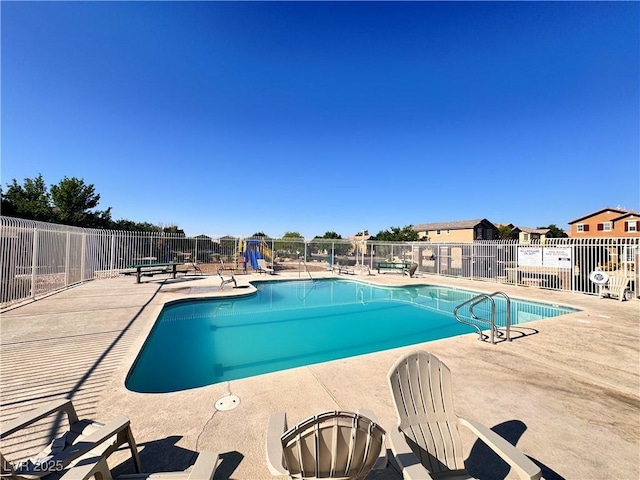5653 Mount Athos St, North Las Vegas, NV 89031 - community pool featuring a patio
