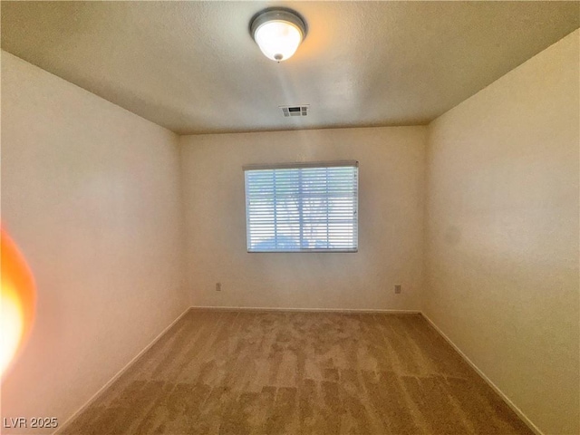 5653 Mount Athos St, North Las Vegas, NV 89031 - spare room featuring carpet and baseboards