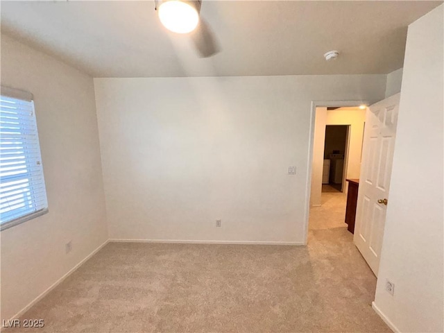 5653 Mount Athos St, North Las Vegas, NV 89031 - unfurnished room with light carpet, a smoke detector, baseboards, and ceiling fan