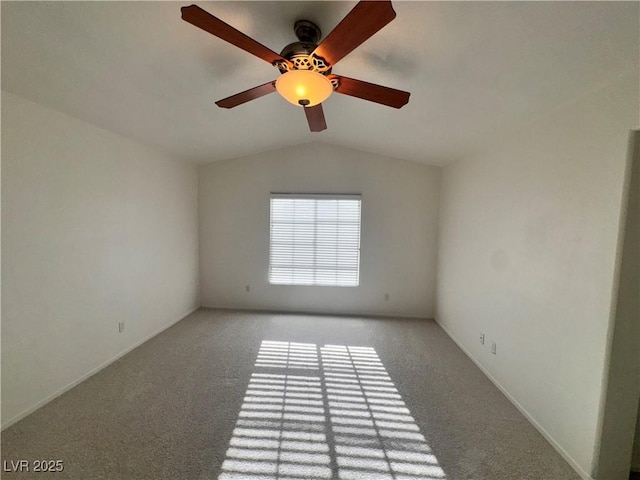 5653 Mount Athos St, North Las Vegas, NV 89031 - unfurnished room with lofted ceiling, light colored carpet, a ceiling fan, and baseboards