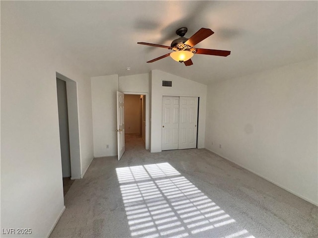 5653 Mount Athos St, North Las Vegas, NV 89031 - unfurnished bedroom with lofted ceiling, light colored carpet, a closet, and a ceiling fan