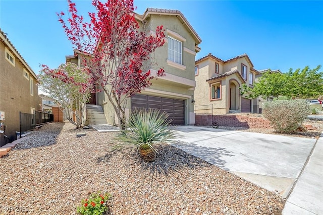 5079 Quiet Falls Ct, Las Vegas, NV 89141 - mediterranean / spanish home featuring a garage, stucco siding, concrete driveway, and a tile roof