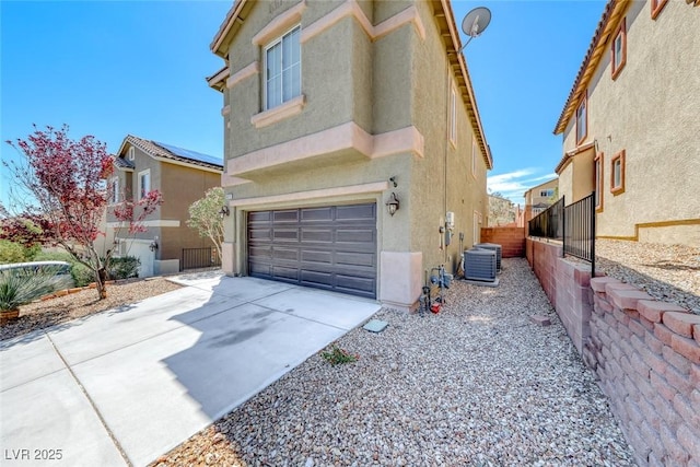 5079 Quiet Falls Ct, Las Vegas, NV 89141 - view of front of house featuring stucco siding, concrete driveway, a garage, and cooling unit