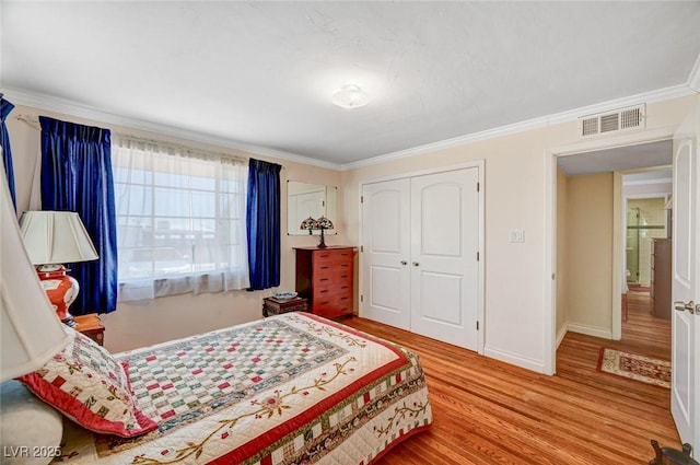 557 6th St, Boulder City, NV 89005 - bedroom featuring wood finished floors, a closet, ornamental molding, and baseboards