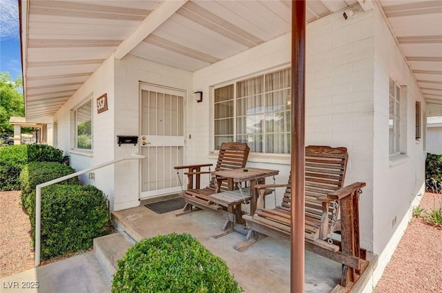 557 6th St, Boulder City, NV 89005 - doorway to property featuring a porch and concrete block siding