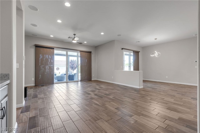 7072 Arabian Ridge St, Las Vegas, NV 89131 - unfurnished living room with wood finished floors, baseboards, recessed lighting, and a ceiling fan