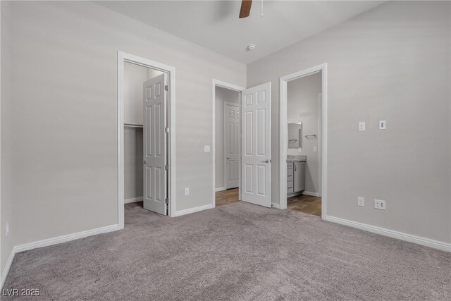7072 Arabian Ridge St, Las Vegas, NV 89131 - unfurnished bedroom featuring carpet flooring, a walk in closet, baseboards, and ensuite bath