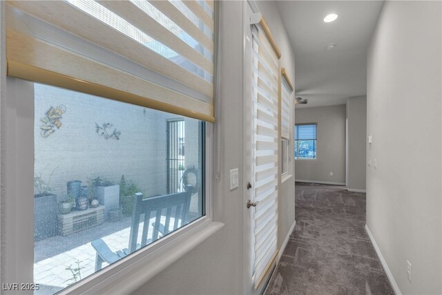 7072 Arabian Ridge St, Las Vegas, NV 89131 - hall with dark carpet and baseboards