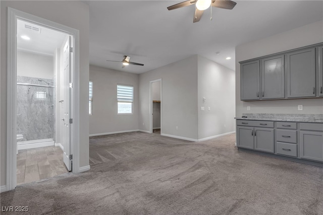 7072 Arabian Ridge St, Las Vegas, NV 89131 - unfurnished living room featuring a ceiling fan, light carpet, baseboards, and recessed lighting