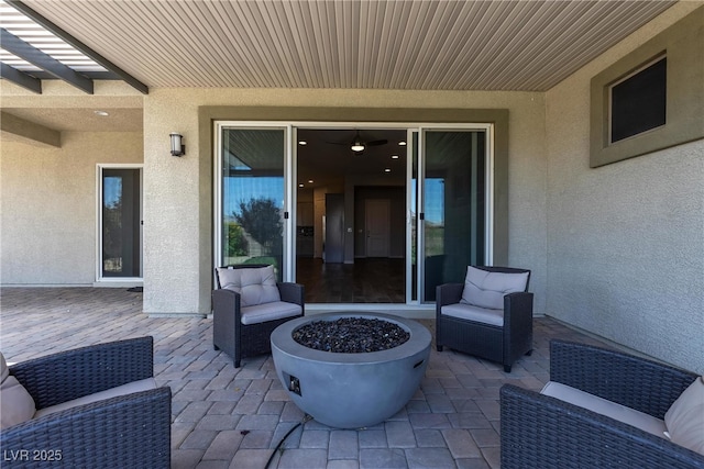7072 Arabian Ridge St, Las Vegas, NV 89131 - view of patio / terrace with an outdoor fire pit