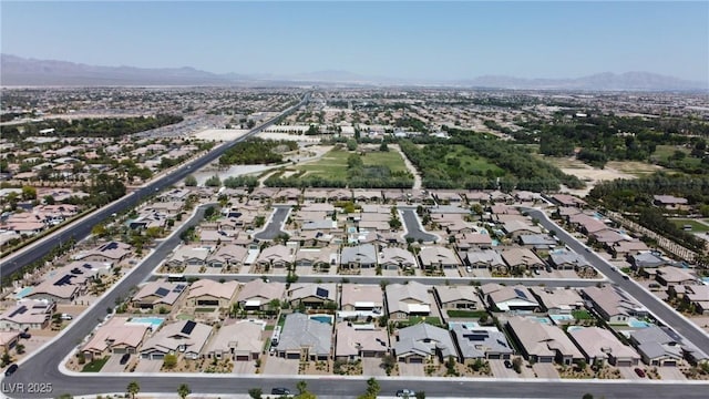 7072 Arabian Ridge St, Las Vegas, NV 89131 - aerial view of property and surrounding area featuring mountains and nearby suburban area