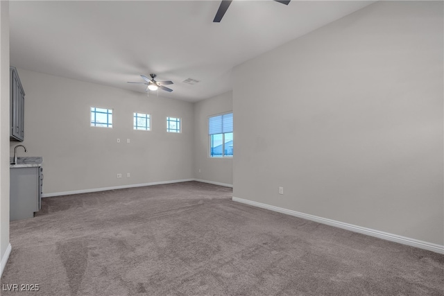 7072 Arabian Ridge St, Las Vegas, NV 89131 - unfurnished living room with a ceiling fan, healthy amount of natural light, and baseboards