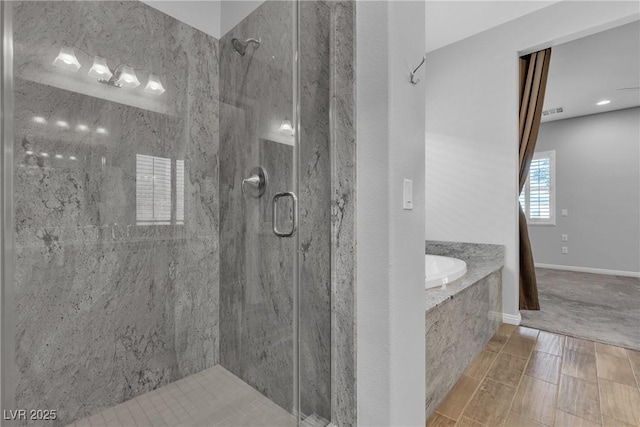 7072 Arabian Ridge St, Las Vegas, NV 89131 - bathroom featuring a marble finish shower and a bath