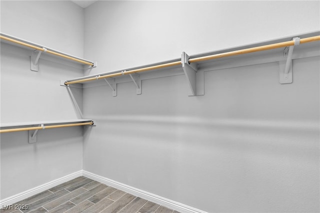 7072 Arabian Ridge St, Las Vegas, NV 89131 - walk in closet with dark wood-type flooring