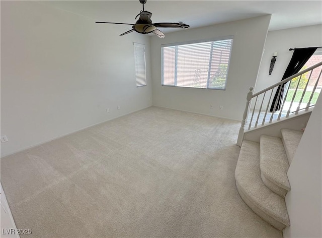 8682 Gateway Glen Dr, Las Vegas, NV 89178 - unfurnished living room featuring ceiling fan, carpet flooring, and stairs