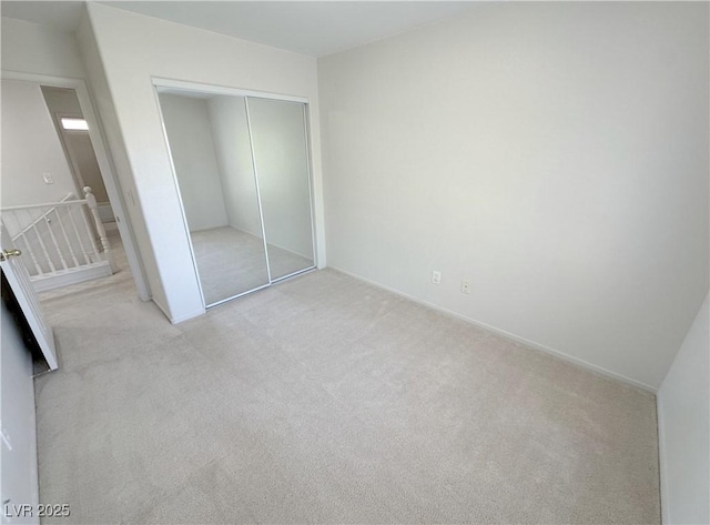 8682 Gateway Glen Dr, Las Vegas, NV 89178 - unfurnished bedroom with light colored carpet, a closet, and baseboards