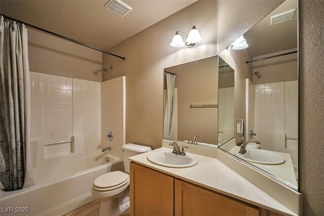 1740 Flores Ln, Henderson, NV 89012 - full bathroom featuring a textured wall, shower / bath combo, vanity, and toilet