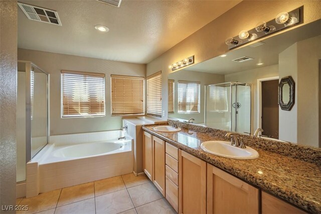 1740 Flores Ln, Henderson, NV 89012 - bathroom featuring plenty of natural light, a shower stall, a garden tub, and double vanity