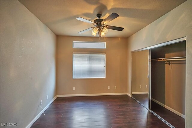 1740 Flores Ln, Henderson, NV 89012 - unfurnished bedroom with dark wood finished floors, a closet, ceiling fan, and baseboards