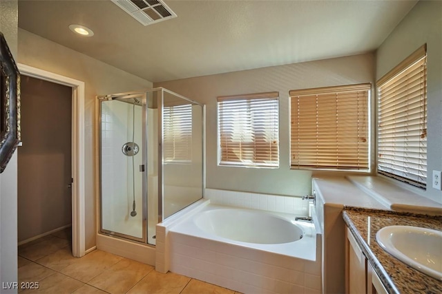 1740 Flores Ln, Henderson, NV 89012 - full bath featuring a shower stall, a garden tub, tile patterned floors, vanity, and recessed lighting
