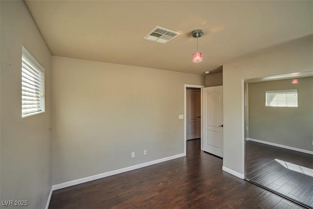 1740 Flores Ln, Henderson, NV 89012 - empty room featuring dark wood finished floors and baseboards
