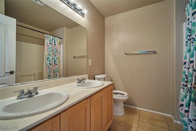 1740 Flores Ln, Henderson, NV 89012 - full bathroom featuring toilet, double vanity, tile patterned floors, a shower with shower curtain, and baseboards
